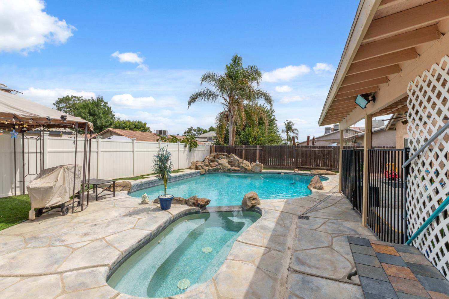 180 Cheney Lane Coalinga, CA 93210 - Photo 30 of 33 a view of swimming pool with outdoor seating and plants