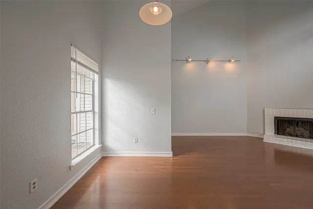 a kitchen with granite countertop a sink stove and cabinets
