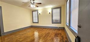 800 Verner Street Northwest Atlanta, GA 30318 - Photo 2 of 8 a view of an empty room with window and wooden floor