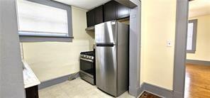 800 Verner Street Northwest Atlanta, GA 30318 - Photo 5 of 8 a view of a kitchen with a refrigerator and window