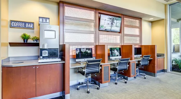 a view of a workspace with furniture