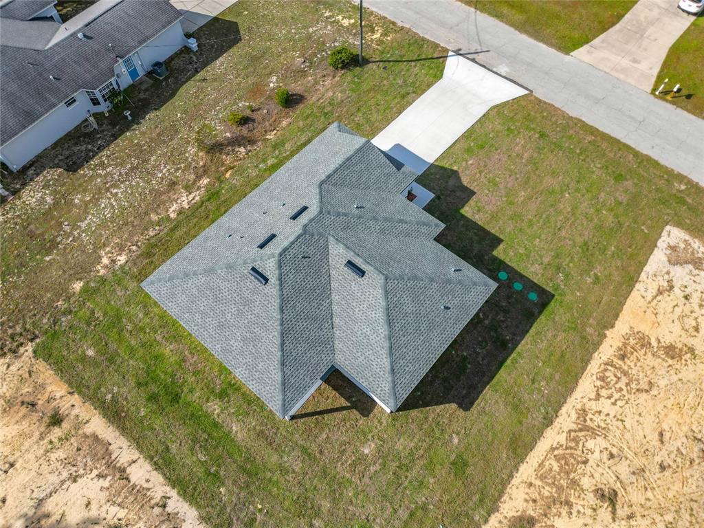 8425 North Legacy Loop Citrus Springs, FL 34433 - Photo 45 of 51 a view of a house with a yard