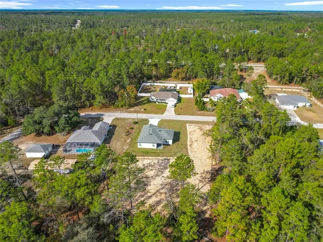 a view of a yard with a tree