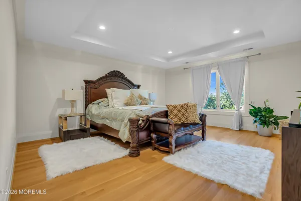 a bedroom with a bed and a potted plant