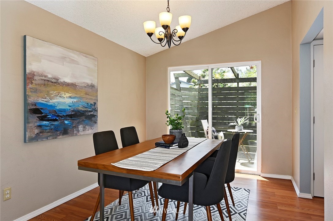 795 South 27th Street Renton, WA 98055 - Photo 4 of 14 a view of a dining room with furniture a chandelier and wooden floor