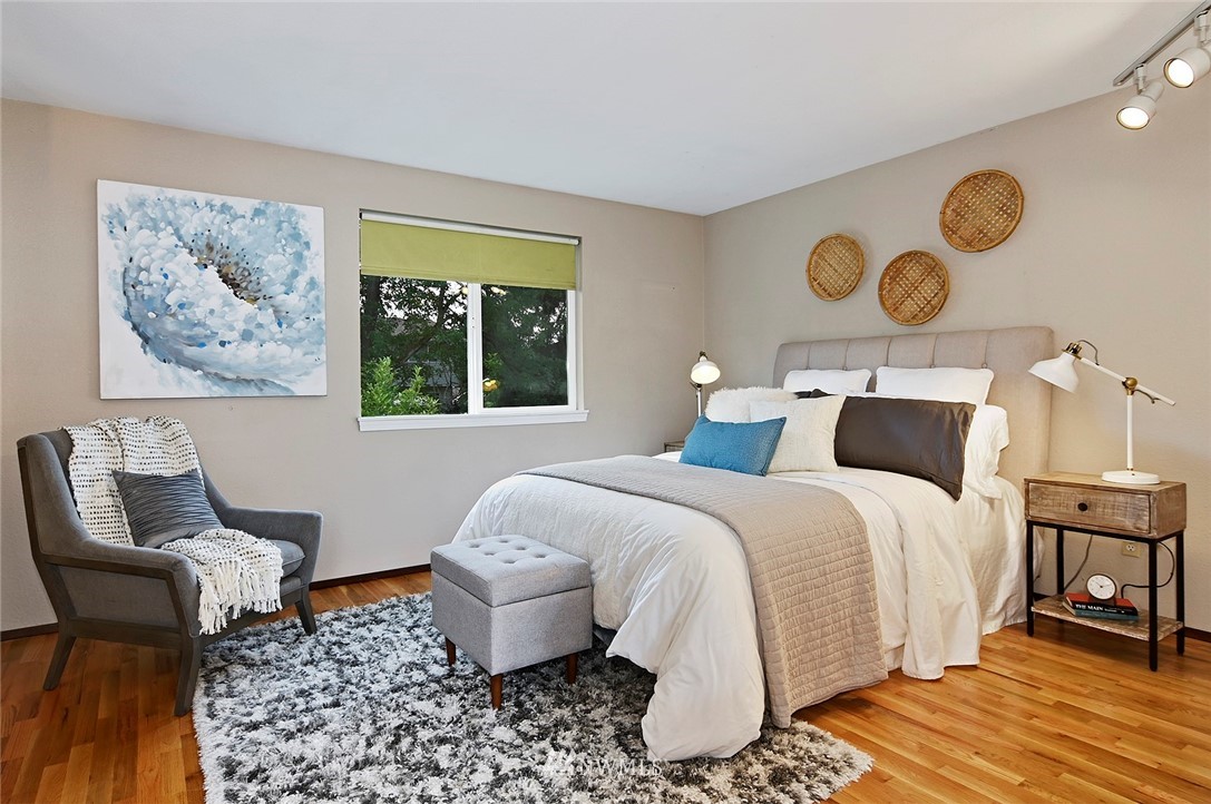 795 South 27th Street Renton, WA 98055 - Photo 7 of 14 a bedroom with a bed and painting on the wall