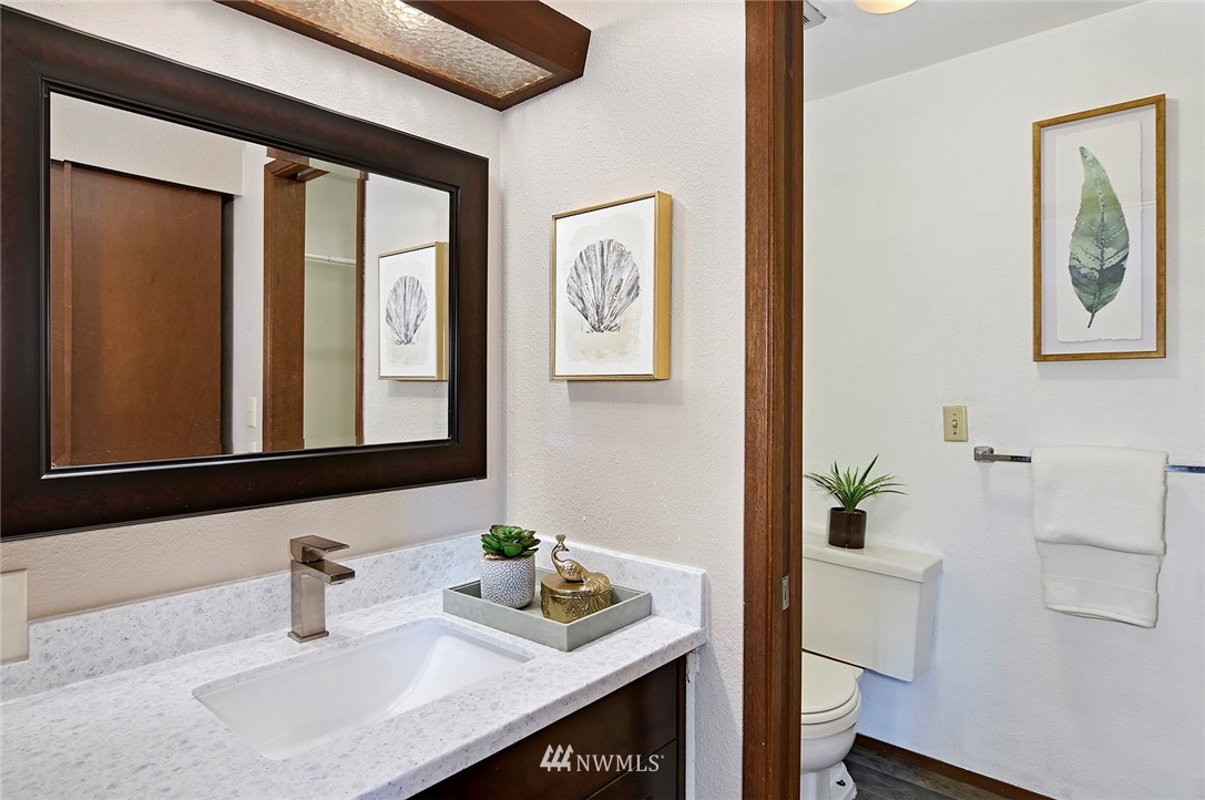 795 South 27th Street Renton, WA 98055 - Photo 8 of 14 a bathroom with a sink a vanity and mirror