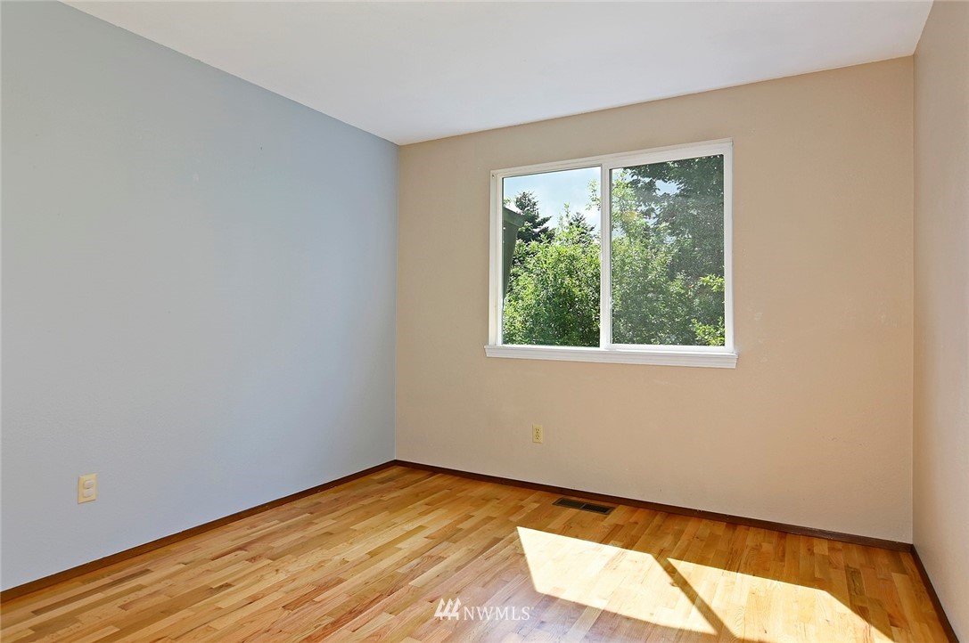 795 South 27th Street Renton, WA 98055 - Photo 9 of 14 a view of empty room with wooden floor and fan