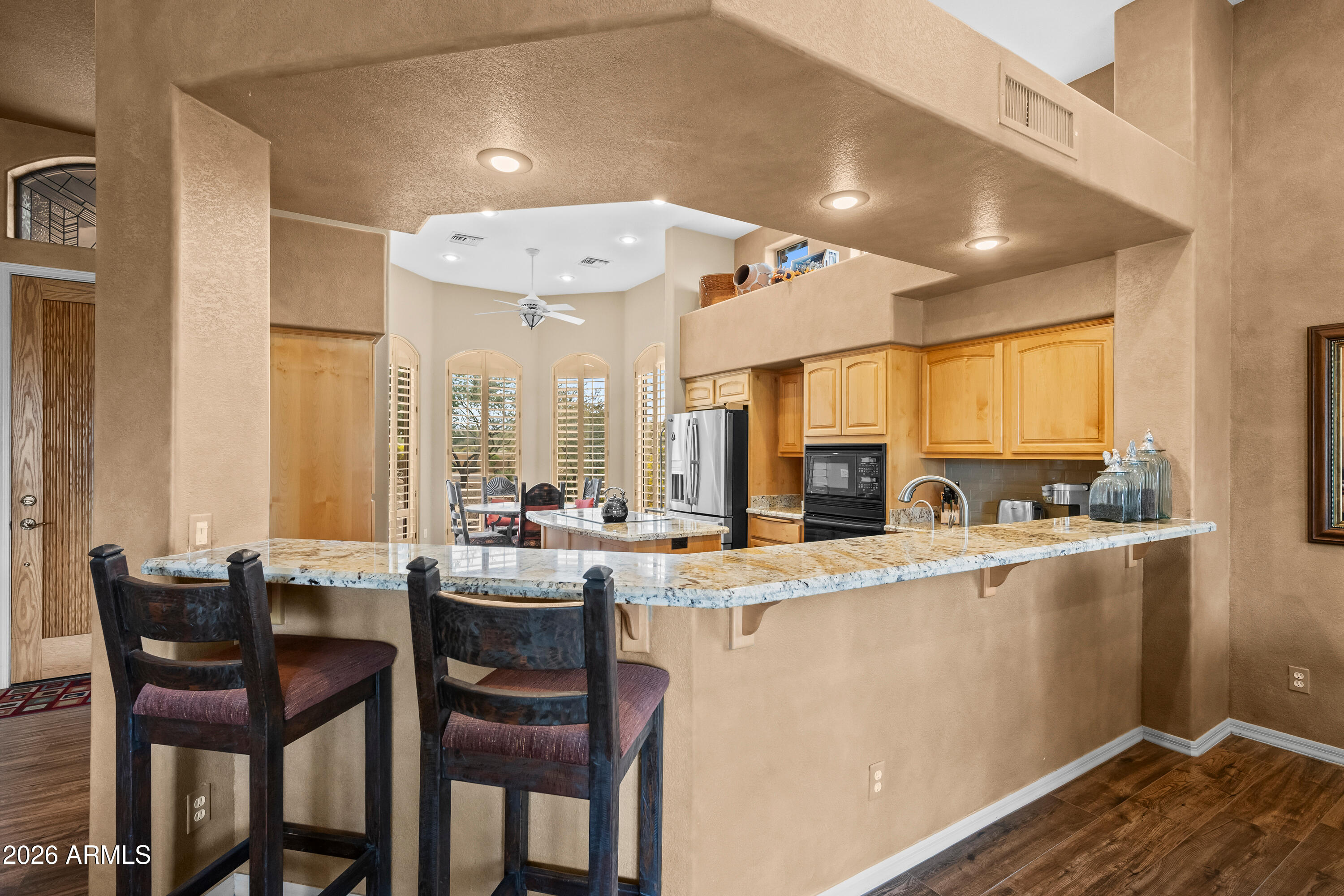 18908 East Quartz Way Rio Verde, AZ 85263 - Photo 13 of 40 a large kitchen with a table and chairs