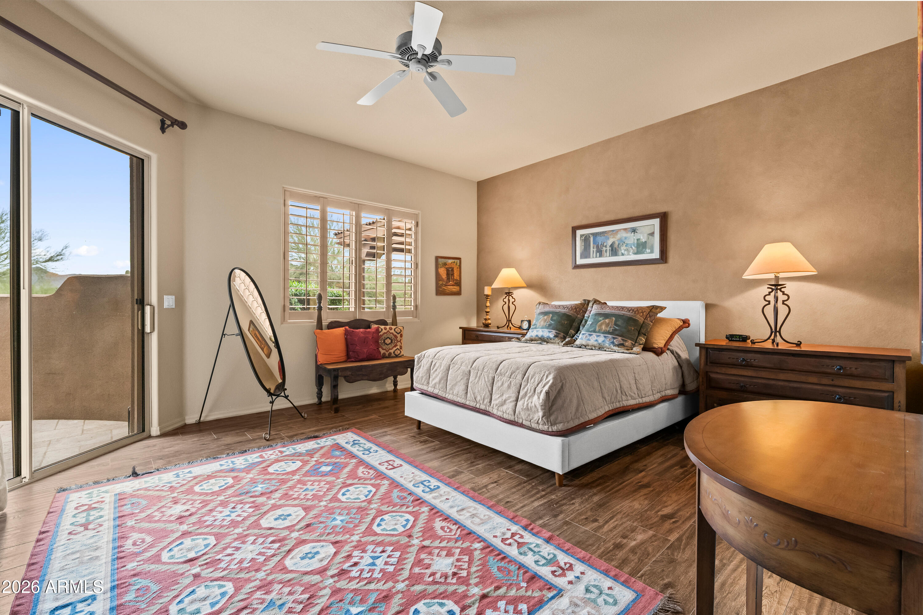 18908 East Quartz Way Rio Verde, AZ 85263 - Photo 20 of 40 a spacious bedroom with a bed a couch and dresser