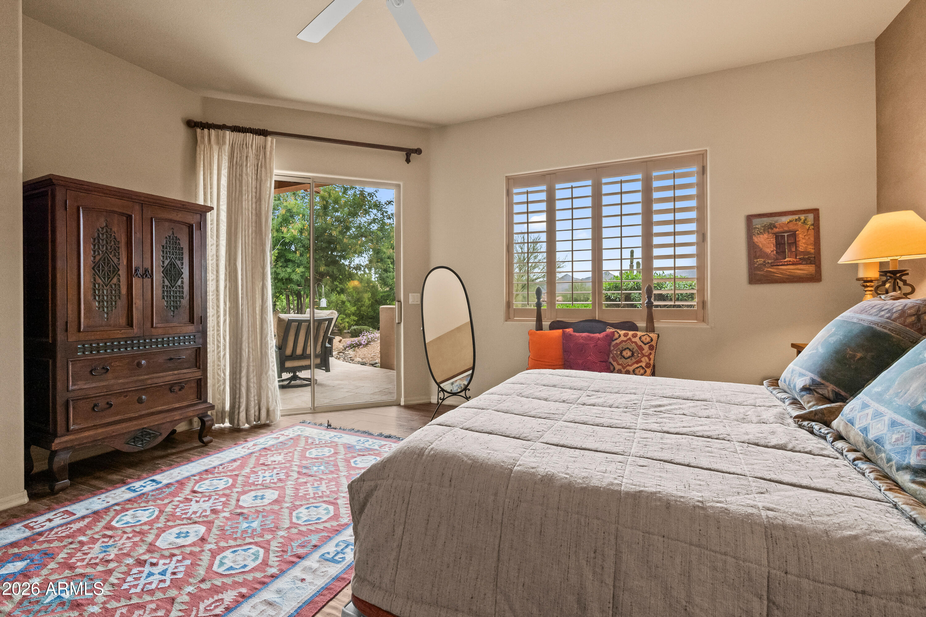 18908 East Quartz Way Rio Verde, AZ 85263 - Photo 21 of 40 a bedroom with a bed large window and a dresser