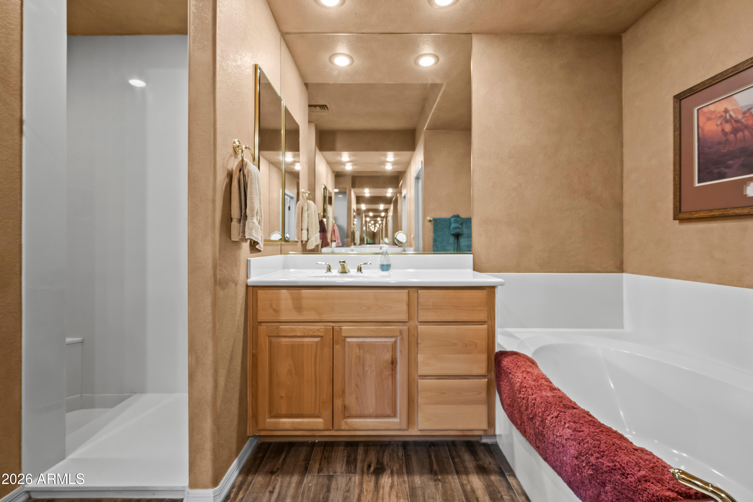 18908 East Quartz Way Rio Verde, AZ 85263 - Photo 24 of 40 a bathroom with a bathtub a sink and a mirror