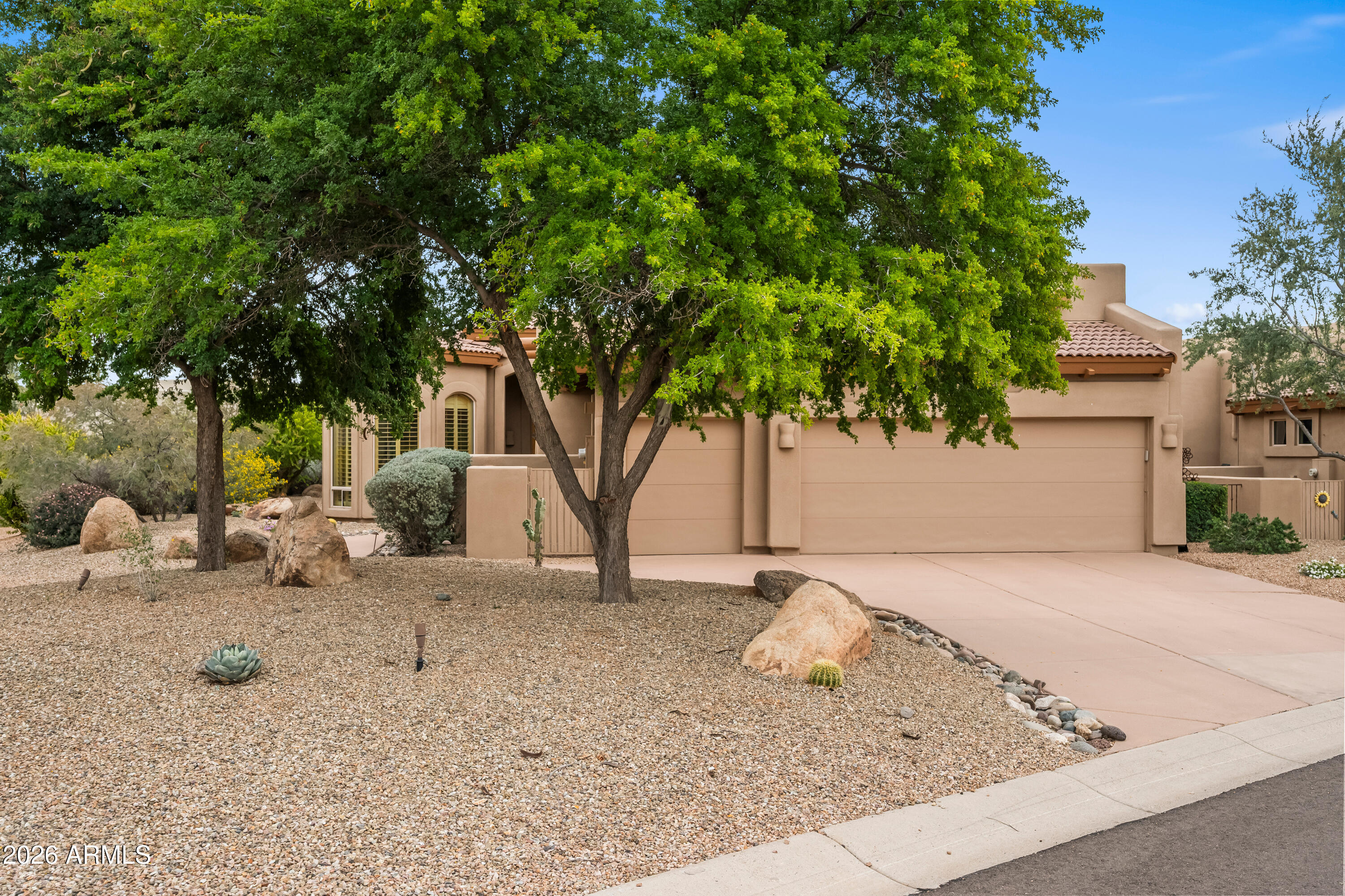 18908 East Quartz Way Rio Verde, AZ 85263 - Photo 3 of 40 a view of a backyard with a tree