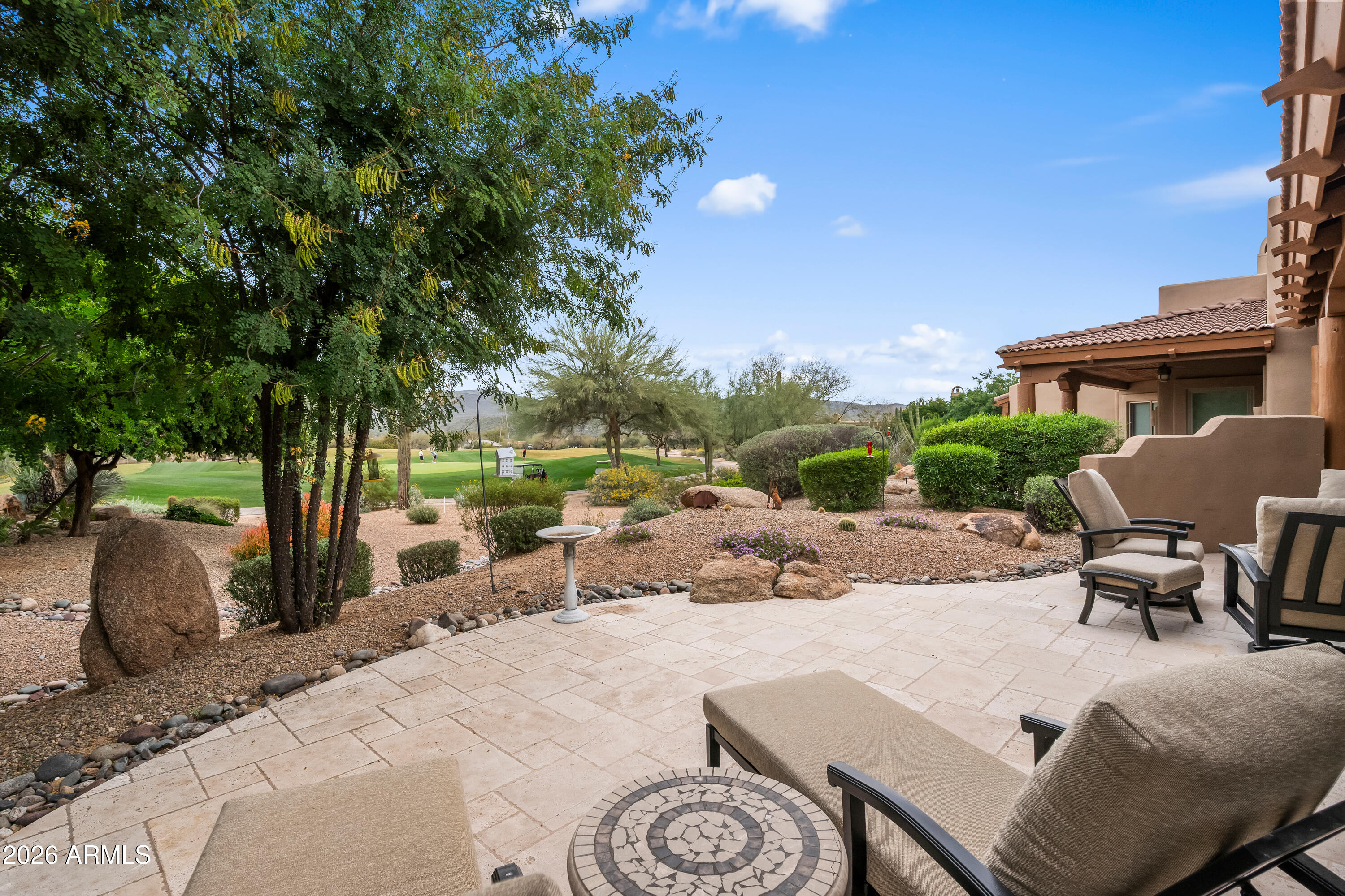 18908 East Quartz Way Rio Verde, AZ 85263 - Photo 33 of 40 a view of a patio with a table and chairs under an umbrella