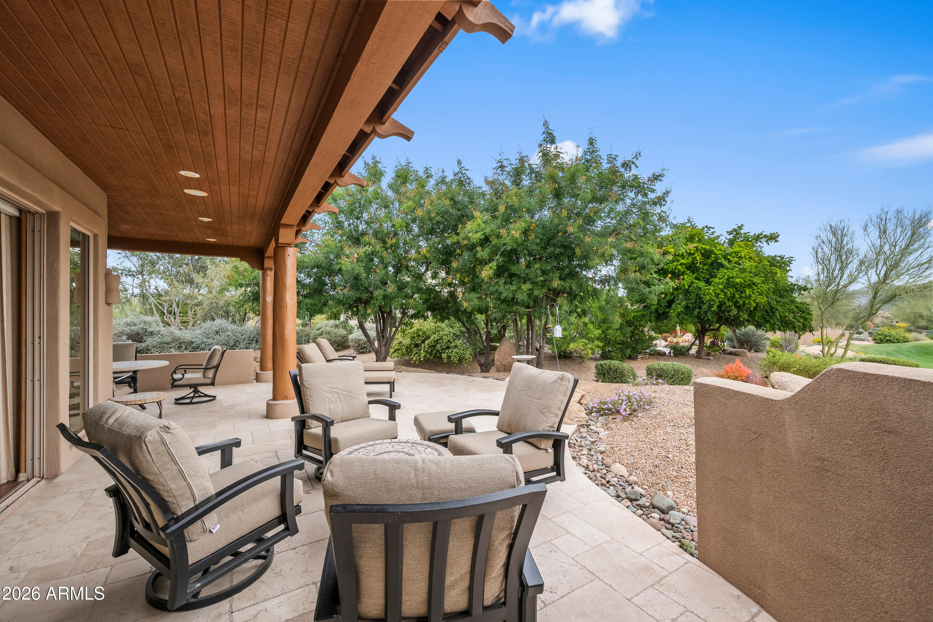 18908 East Quartz Way Rio Verde, AZ 85263 - Photo 34 of 40 a view of a patio with table and chairs and potted plants