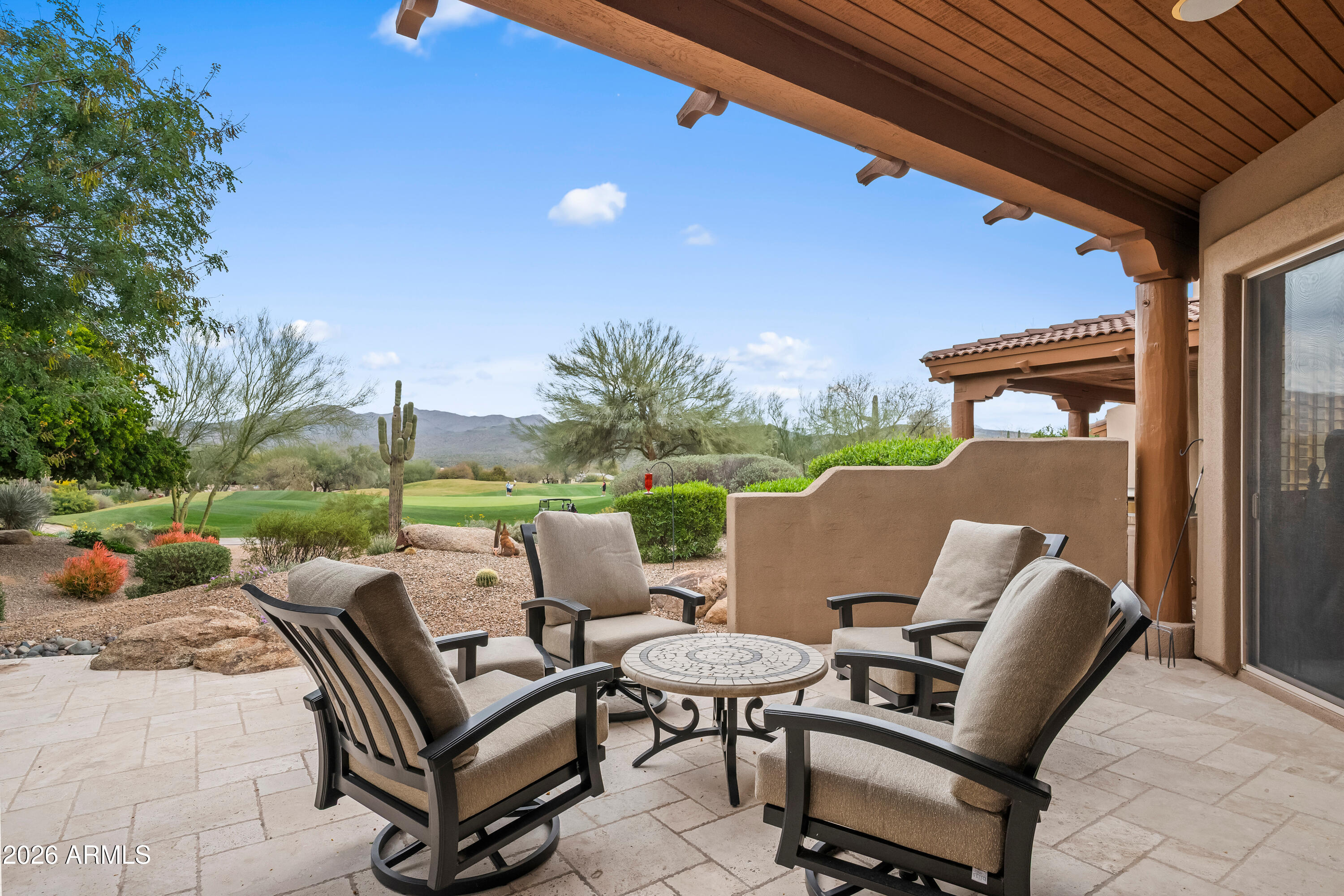 18908 East Quartz Way Rio Verde, AZ 85263 - Photo 35 of 40 a view of a patio with a table and chairs