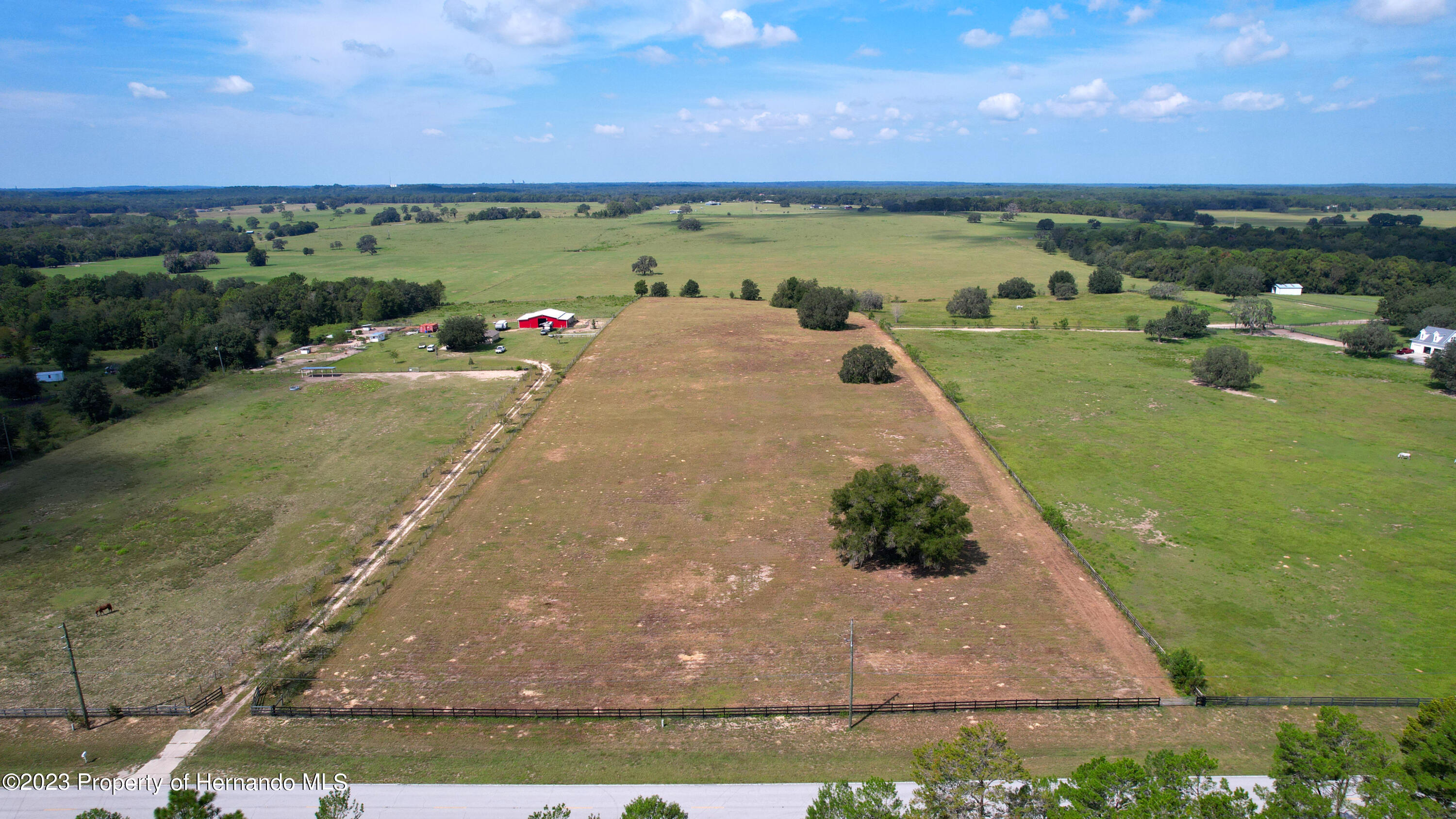 13404 South Pleasant Grove Road Floral City, FL 34436 - Photo 11 of 21 a view of a lake with a yard
