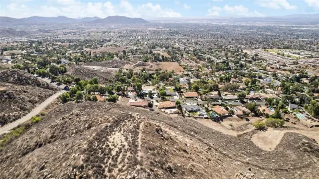 a view of a yard with wooden fence