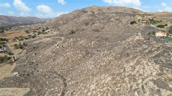 a view of a mountain range with trees in the background