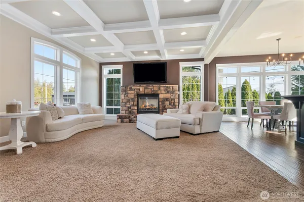 a living room with furniture flat screen tv and a fireplace