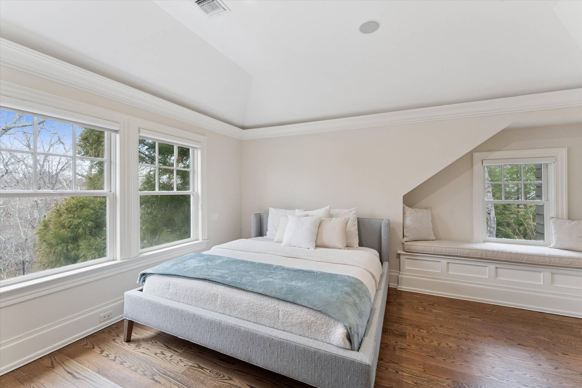 154 Northside Drive Sag Harbor, NY 11963 - Photo 14 of 21 a bedroom with a large bed and a large window