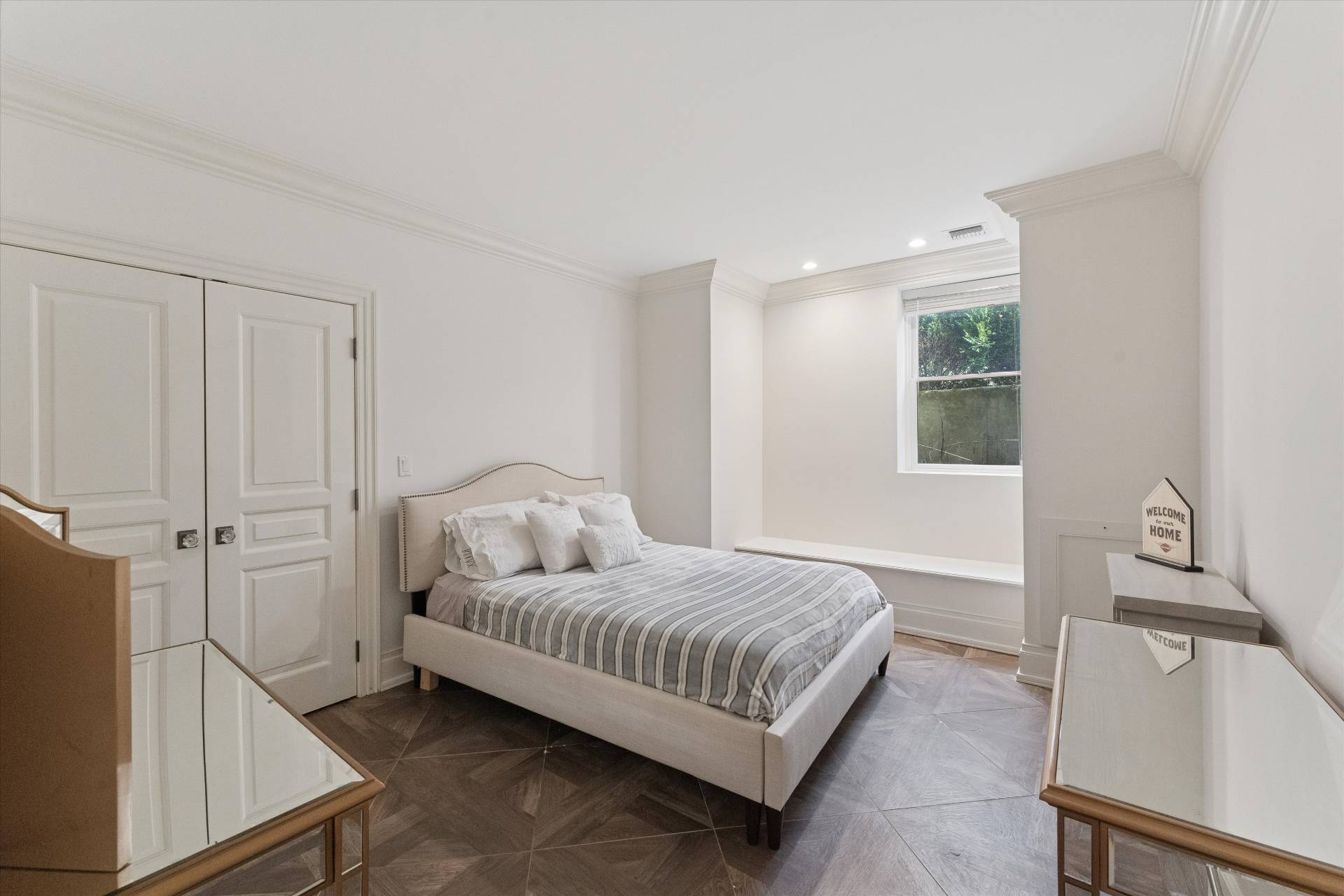 154 Northside Drive Sag Harbor, NY 11963 - Photo 17 of 21 a bedroom with a bed and a dresser with wooden floor