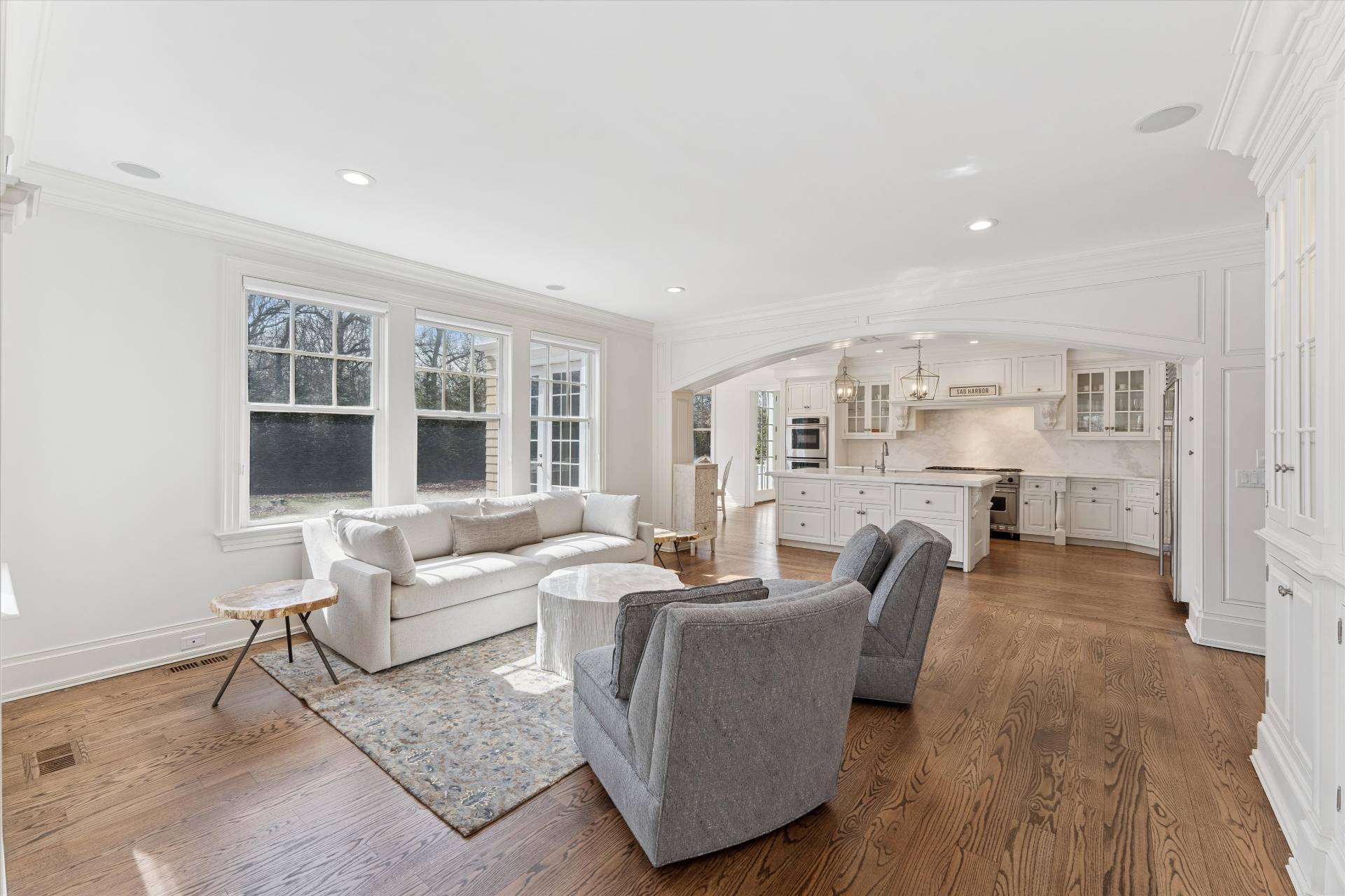 154 Northside Drive Sag Harbor, NY 11963 - Photo 4 of 21 a living room with furniture and a large window