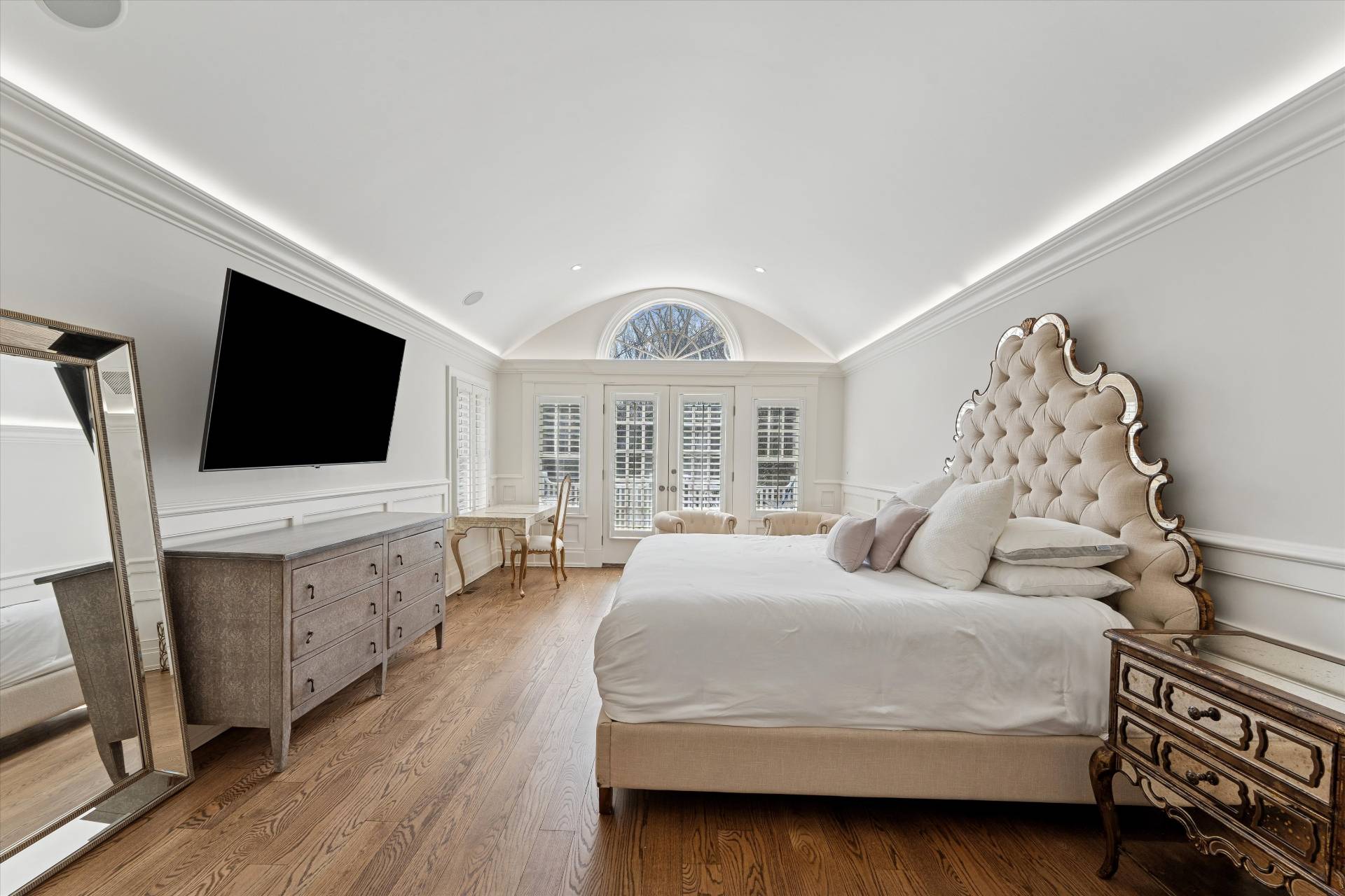 154 Northside Drive Sag Harbor, NY 11963 - Photo 8 of 21 a bedroom with a bed and a flat screen tv