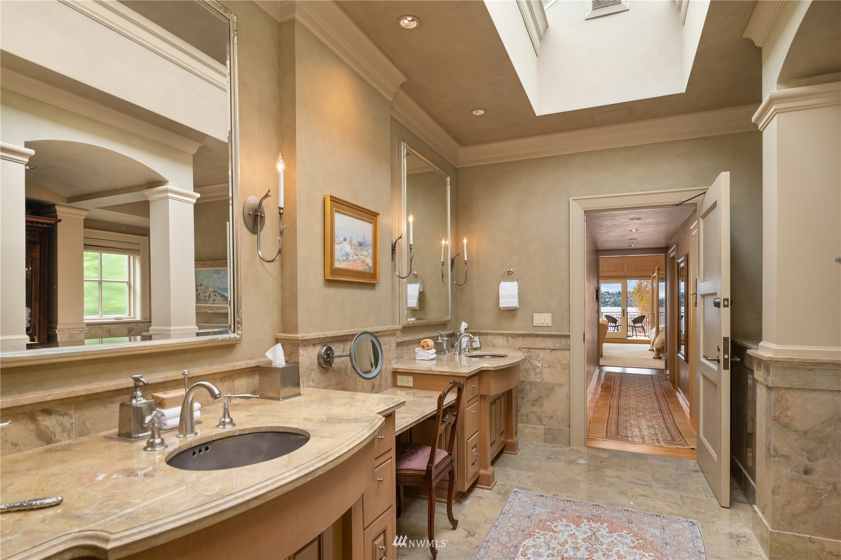 611 Evergreen Point Road Medina, WA 98039 - Photo 19 of 40 a large bathroom with double vanity sinks a large mirror and a shower