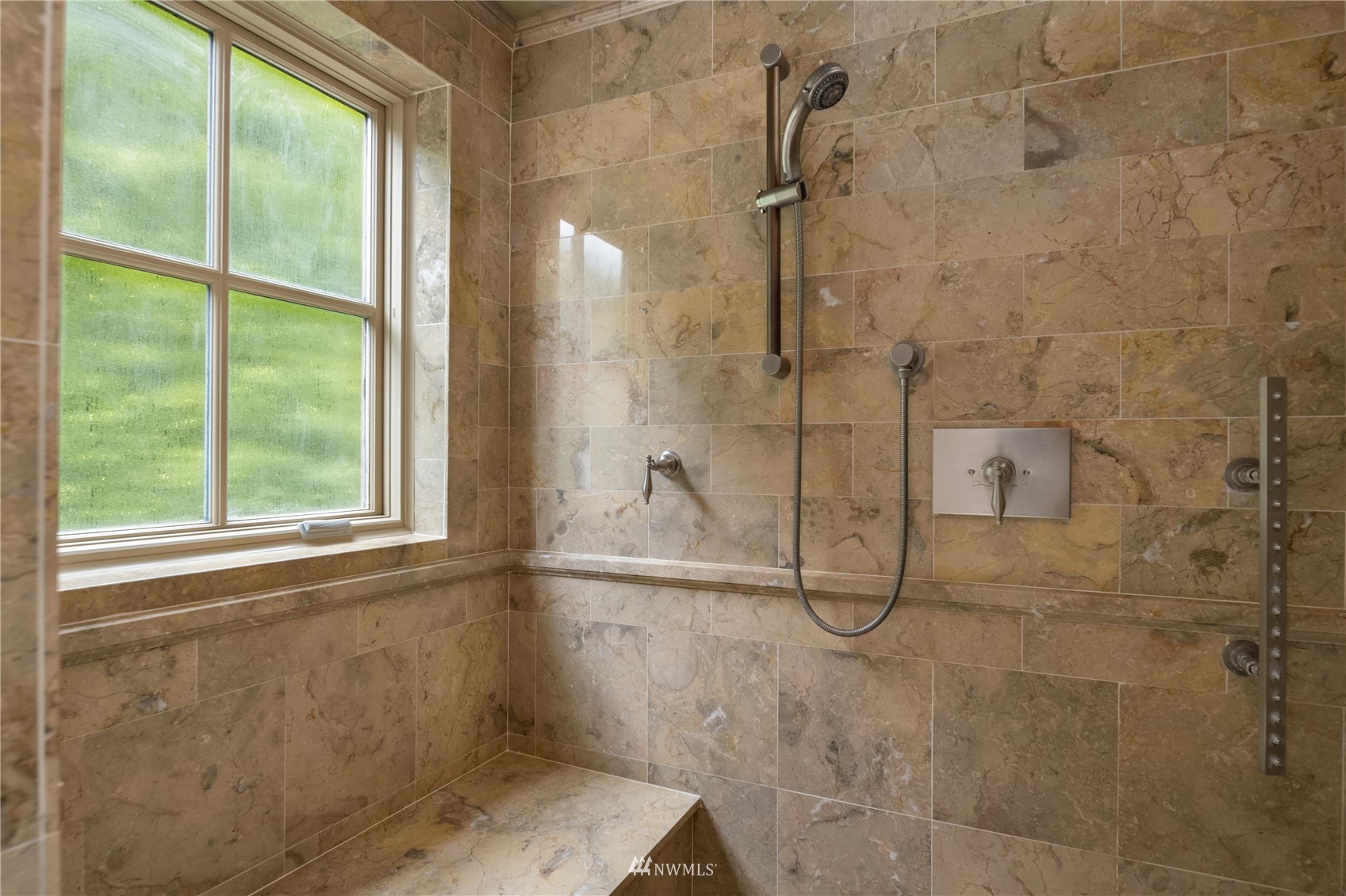 611 Evergreen Point Road Medina, WA 98039 - Photo 20 of 40 a bathroom with a glass shower door