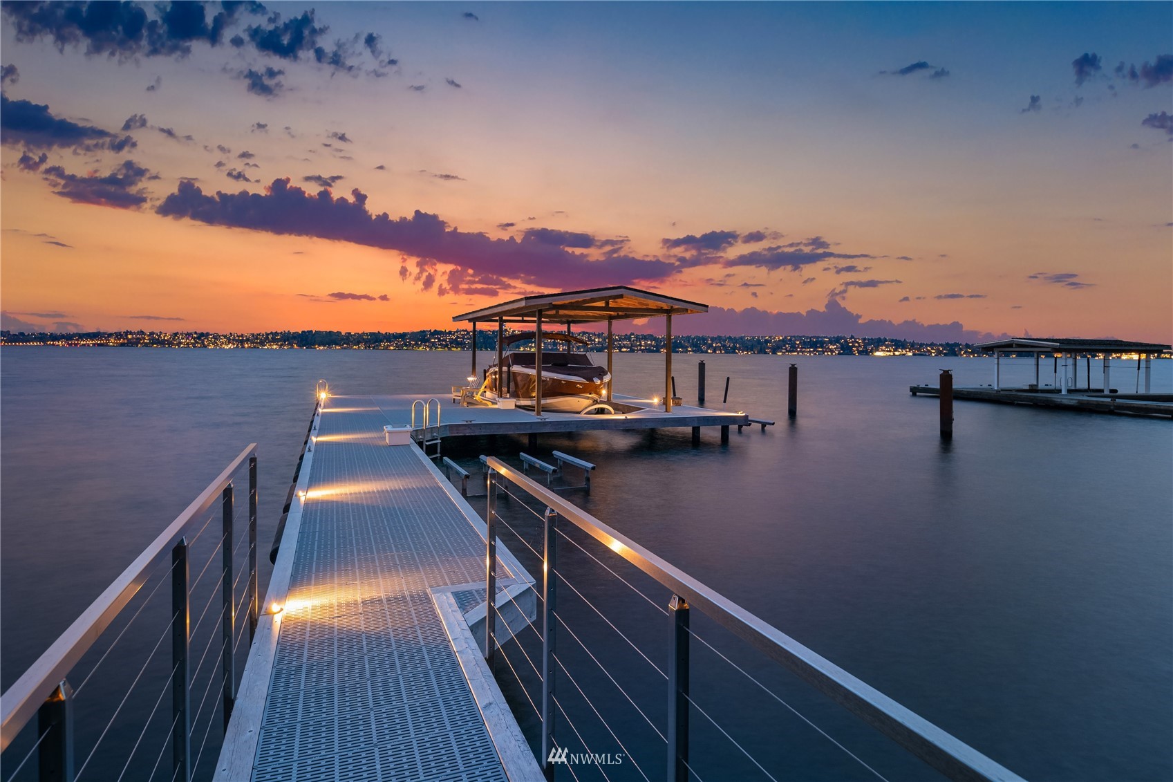 611 Evergreen Point Road Medina, WA 98039 - Photo 2 of 40 a view of a balcony with wooden floor and lake view