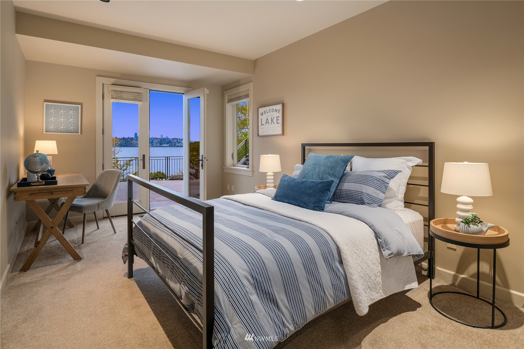 611 Evergreen Point Road Medina, WA 98039 - Photo 31 of 40 a bedroom with a bed and a chandelier