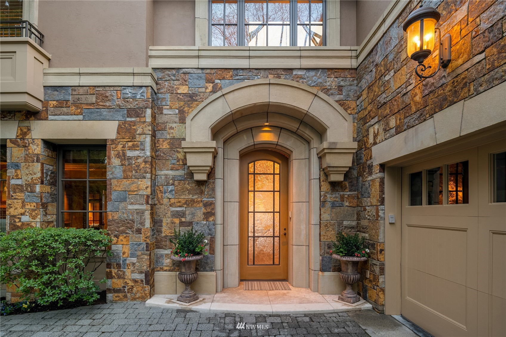 611 Evergreen Point Road Medina, WA 98039 - Photo 36 of 40 a building with a window and potted plants