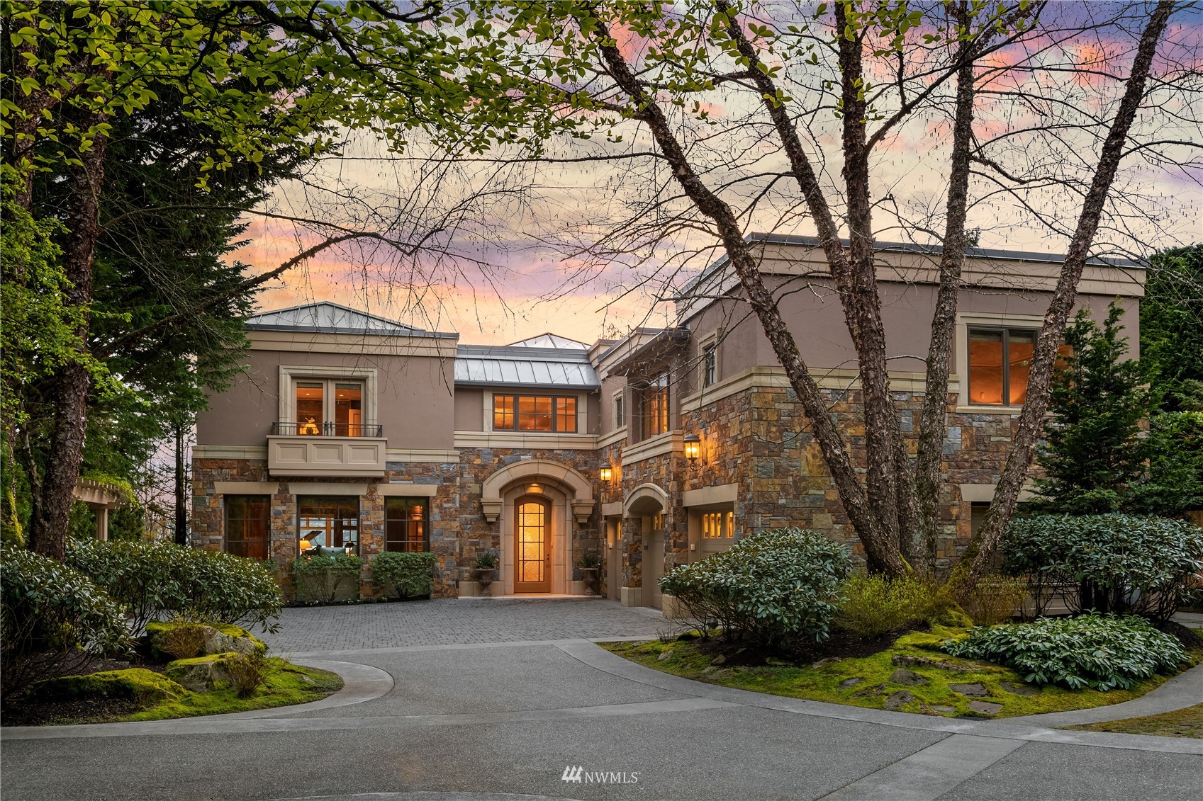 611 Evergreen Point Road Medina, WA 98039 - Photo 5 of 40 a front view of a house with garden