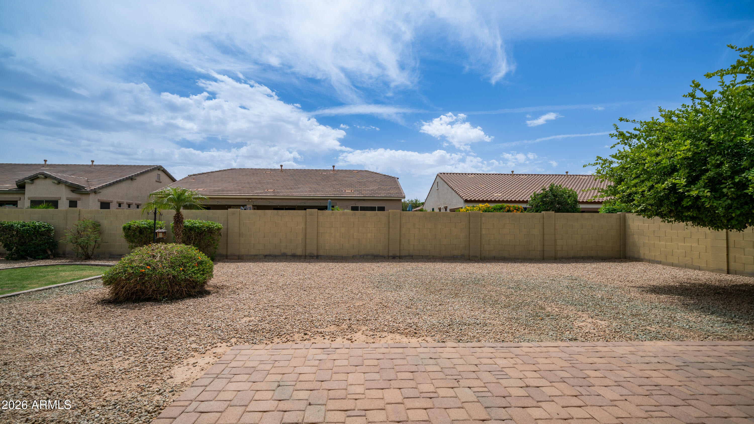 16159 West Granada Road Goodyear, AZ 85395 - Photo 36 of 41 a backyard of a house with lots of green space