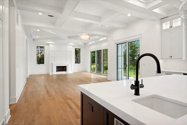 a kitchen with kitchen island a sink and a stove