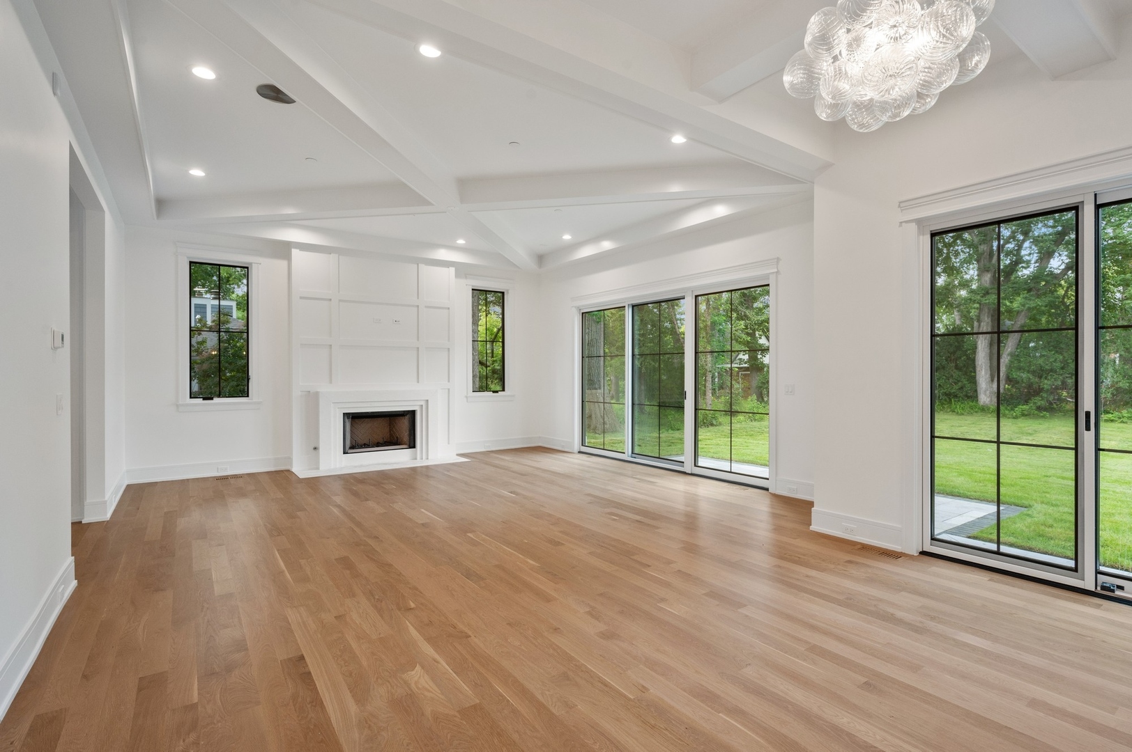 757 Kipling Place Deerfield, IL 60015 - Photo 15 of 35 a view of an empty room with wooden floor and a fireplace