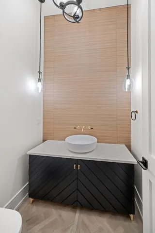 a bathroom with a sink and a mirror