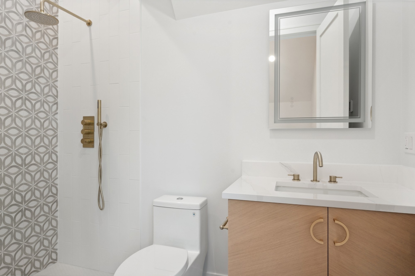 757 Kipling Place Deerfield, IL 60015 - Photo 27 of 35 a bathroom with a toilet sink and mirror