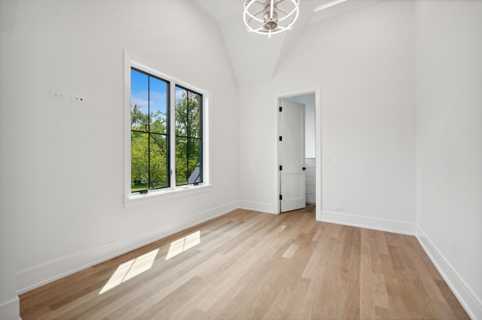 757 Kipling Place Deerfield, IL 60015 - Photo 28 of 35 an empty room with wooden floor and windows