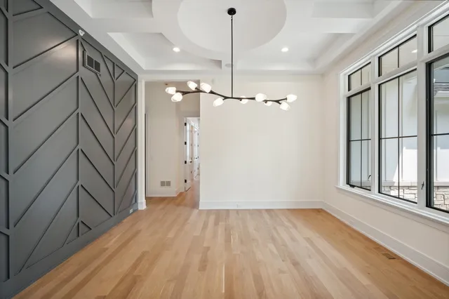 a view of a room with window wooden floor and staircase
