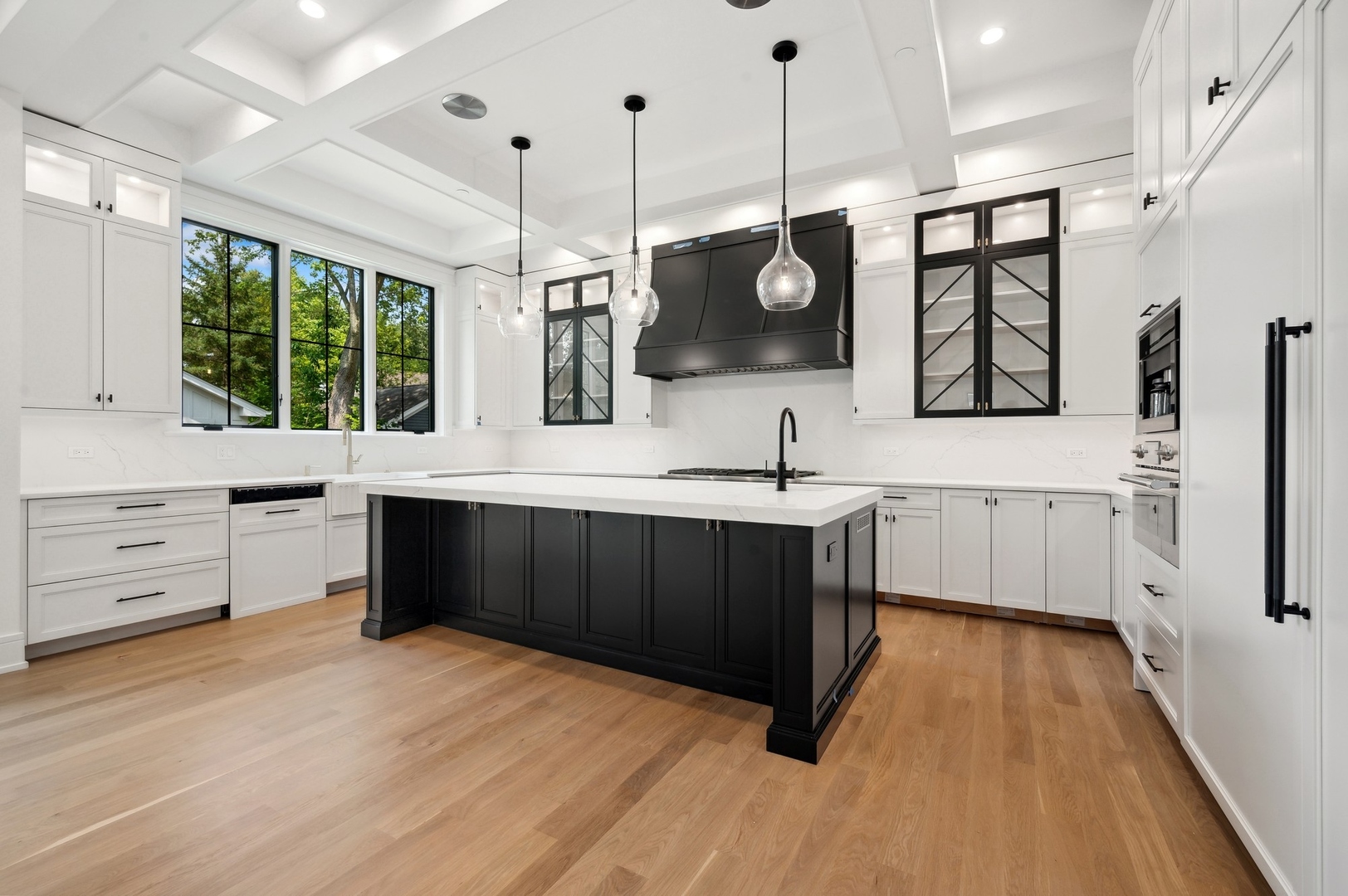757 Kipling Place Deerfield, IL 60015 - Photo 10 of 35 a kitchen with stainless steel appliances kitchen island granite countertop a sink a stove and a wooden floors