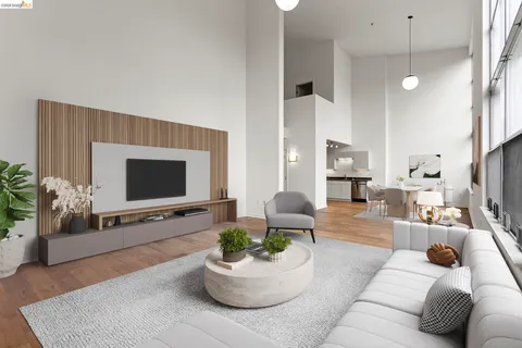 a view of a room with wooden floor and a window