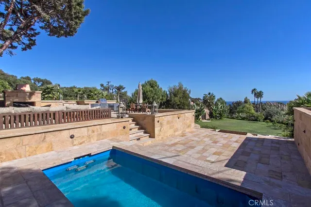 a view of a yard with an outdoor seating
