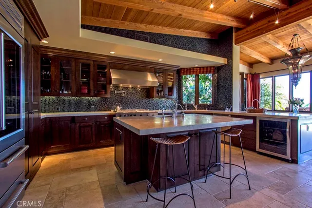 a kitchen with a counter space a sink and appliances