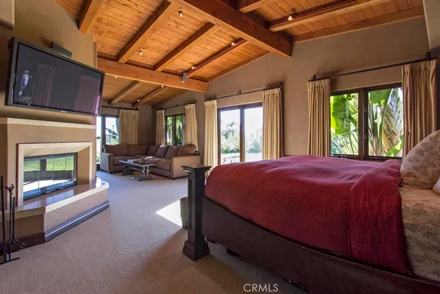 a view of a hallway with couch and a chandelier