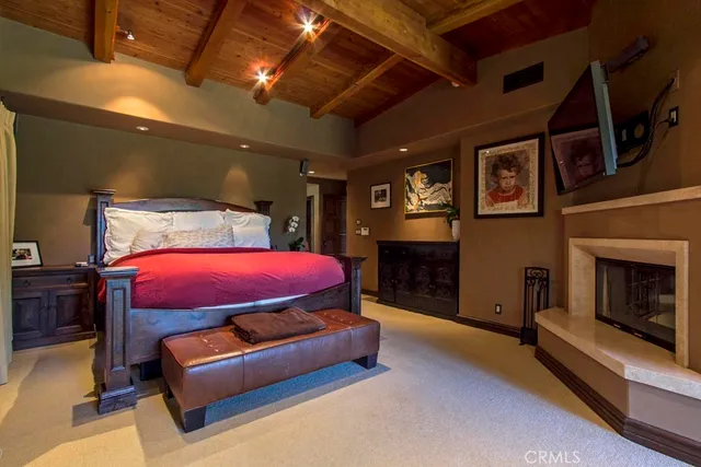a view of a living room with clothes and a rug