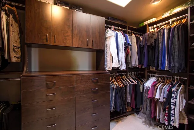 a view of an outdoor living room with furniture and a flat screen tv