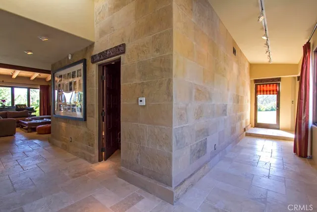 a bathroom with a sink mirror and toilet