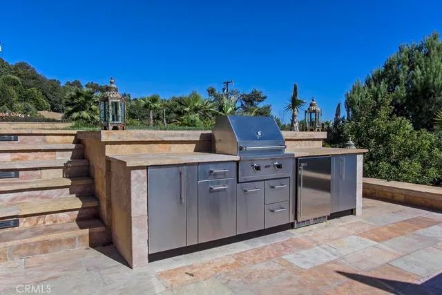a view of a patio with chairs and a yard
